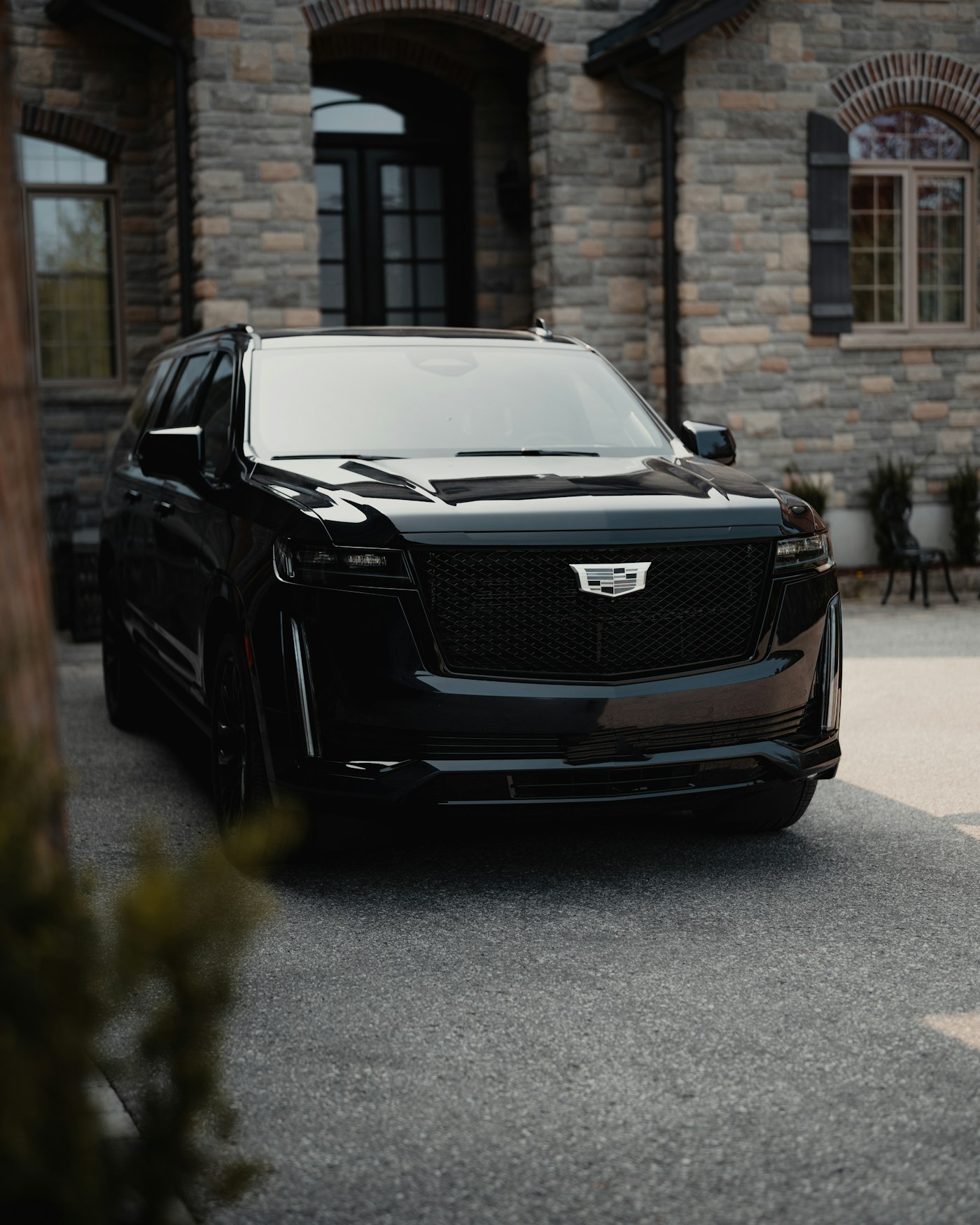 Black executive SUV arriving for a corporate client